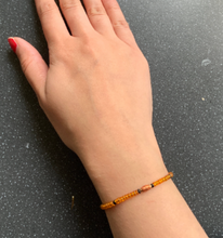 Load image into Gallery viewer, Wheel of Fortune Intention Tie Bracelet Orange Tarot Major Arcana for Fortune & Abundance